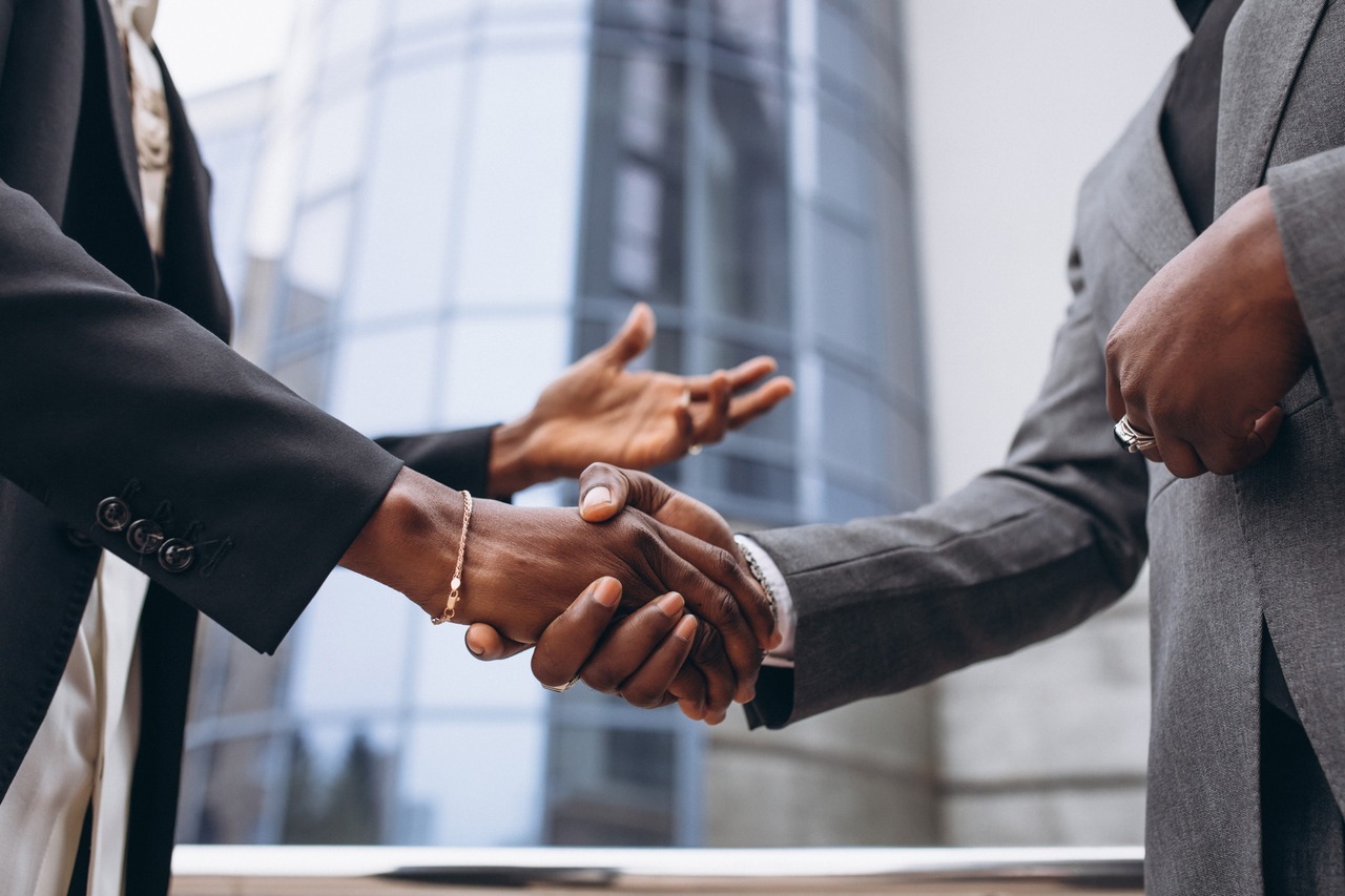 Businesspersons shaking hands.
