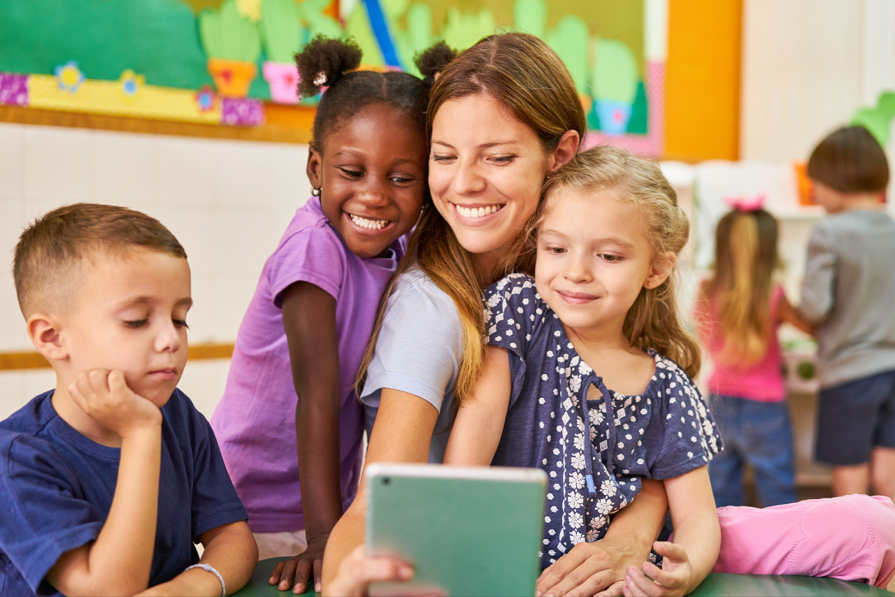 Children Take a Selfie with tablet in school.