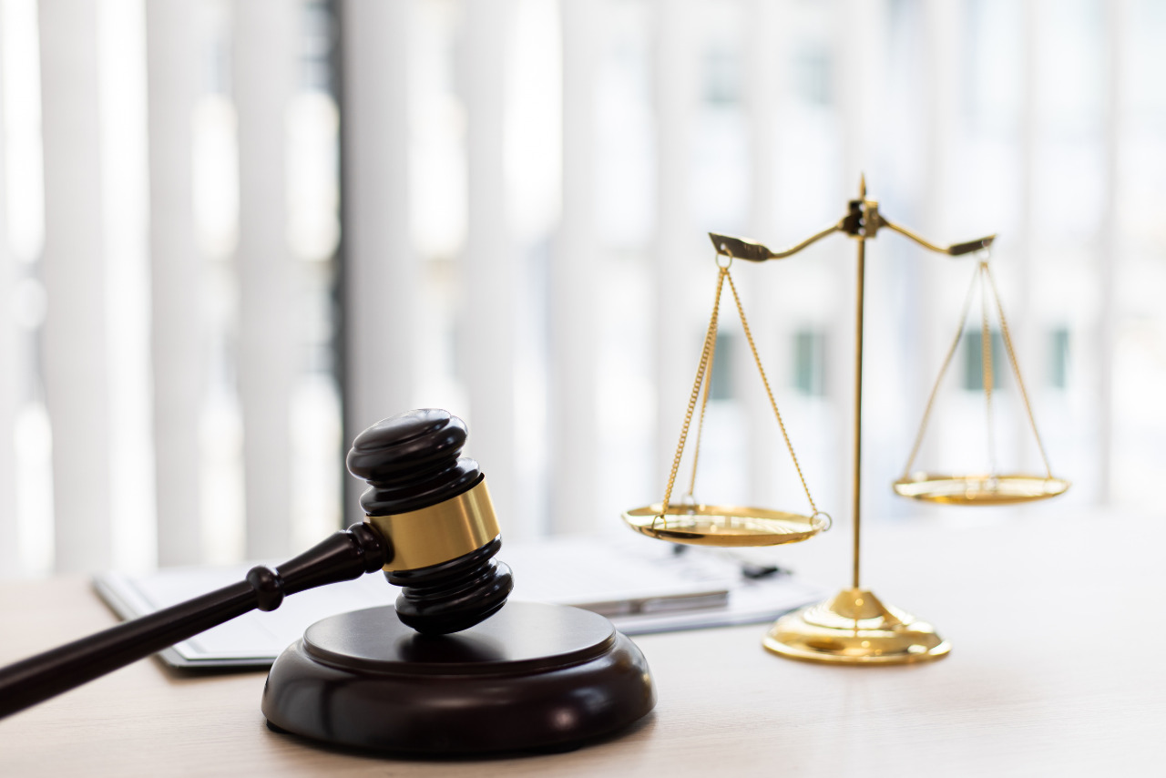 Gavel and scale on table signifying law.