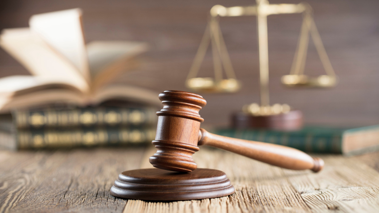 Gavel, scale and books showing legal concept.