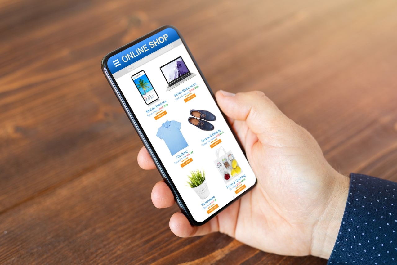 Man Browsing Products On responsive Online Store on a smartphone.