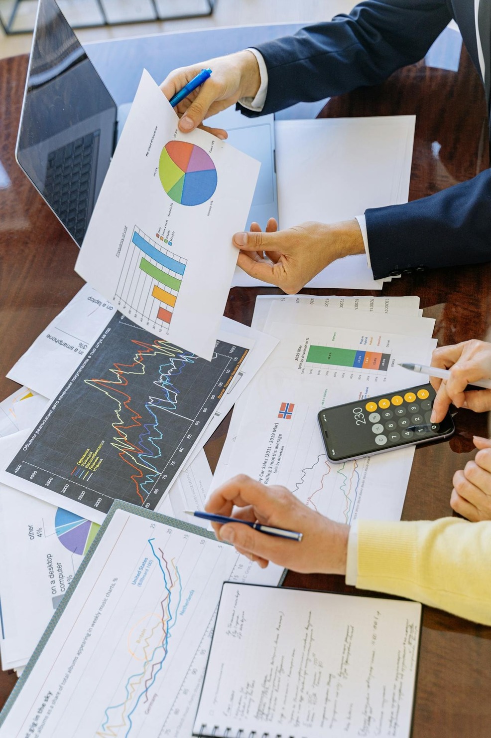 People analyzing different charts
