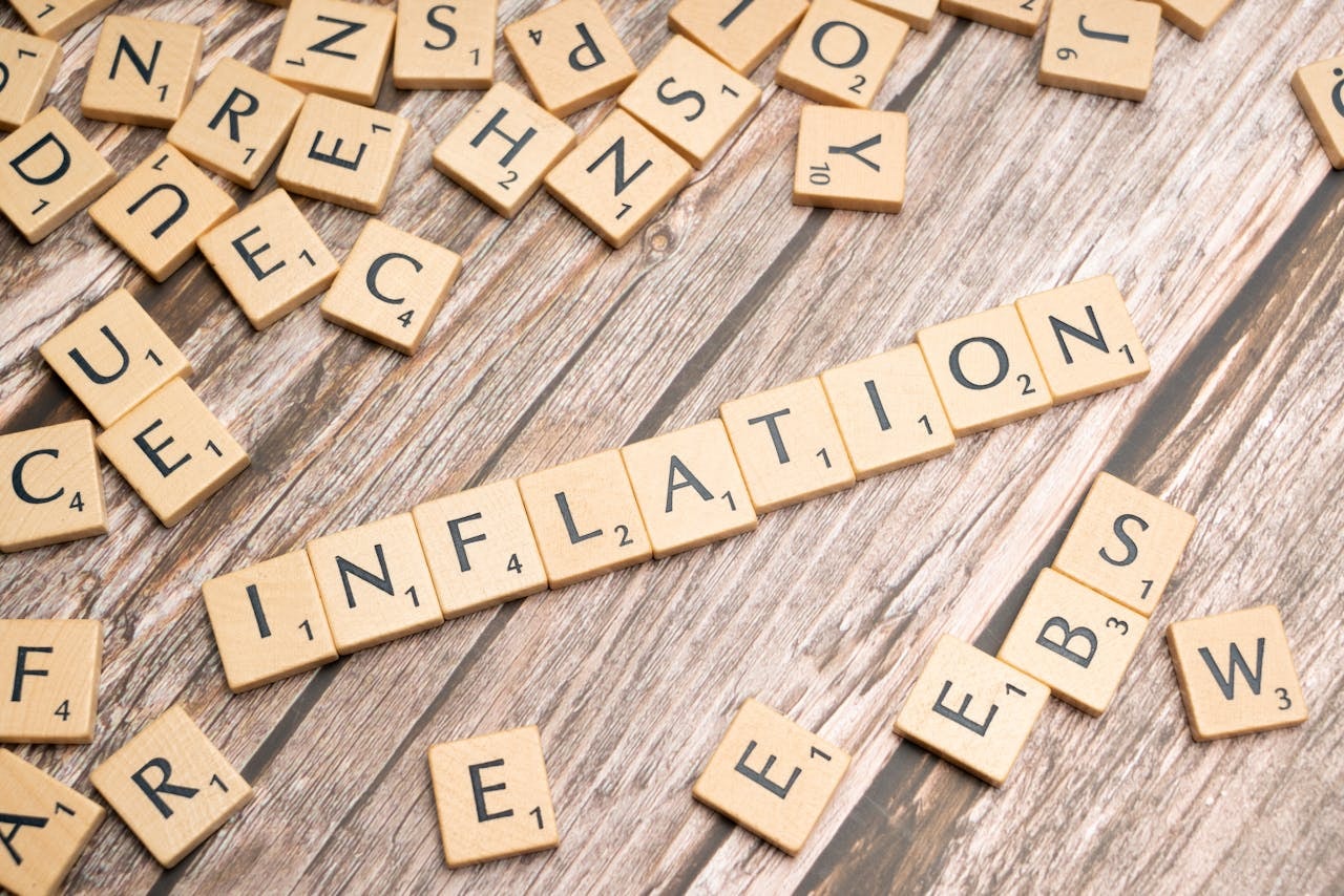 Scrabble tiles that spell out the word Inflation