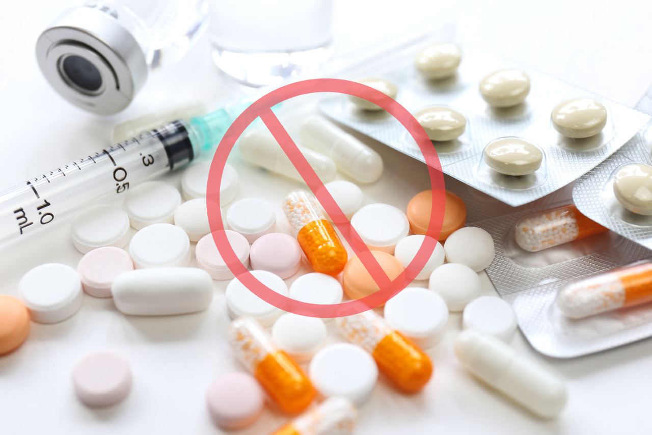 Syringes, tablets, and vials scattered with a restricted sign in the center.