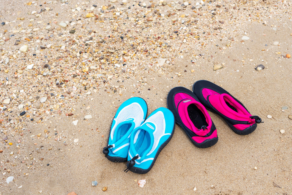 Water shoes on the beach.