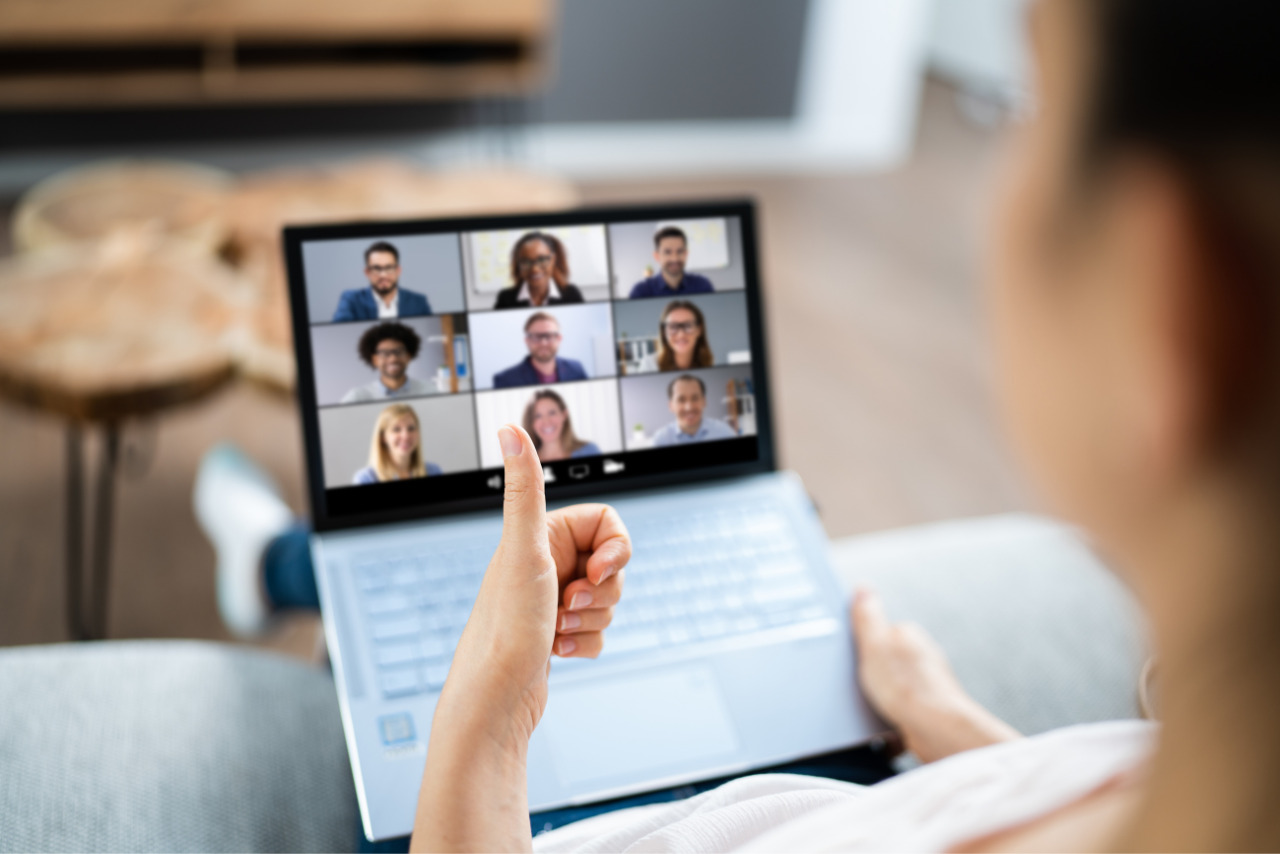 Woman hosting a live webinar with online audiences.