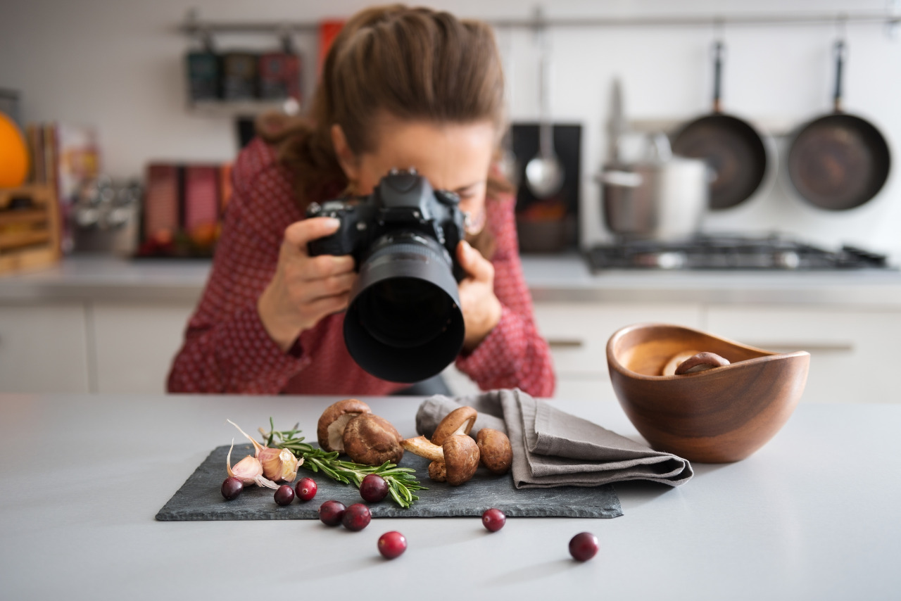 Woman photographer takes high quality photos of vegetables on table.