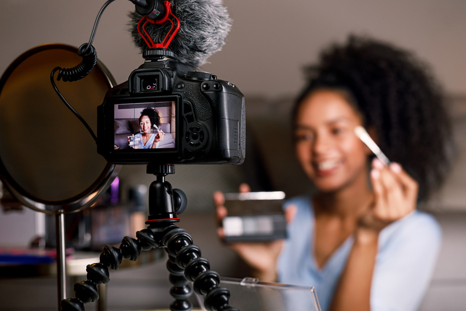 Woman recording a GRWM to post on social media.