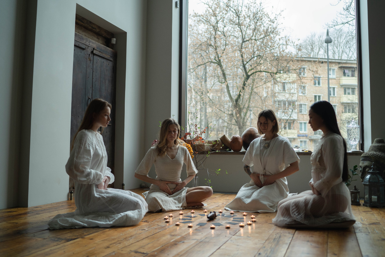 Women in White Dresses Doing Ritual Together.