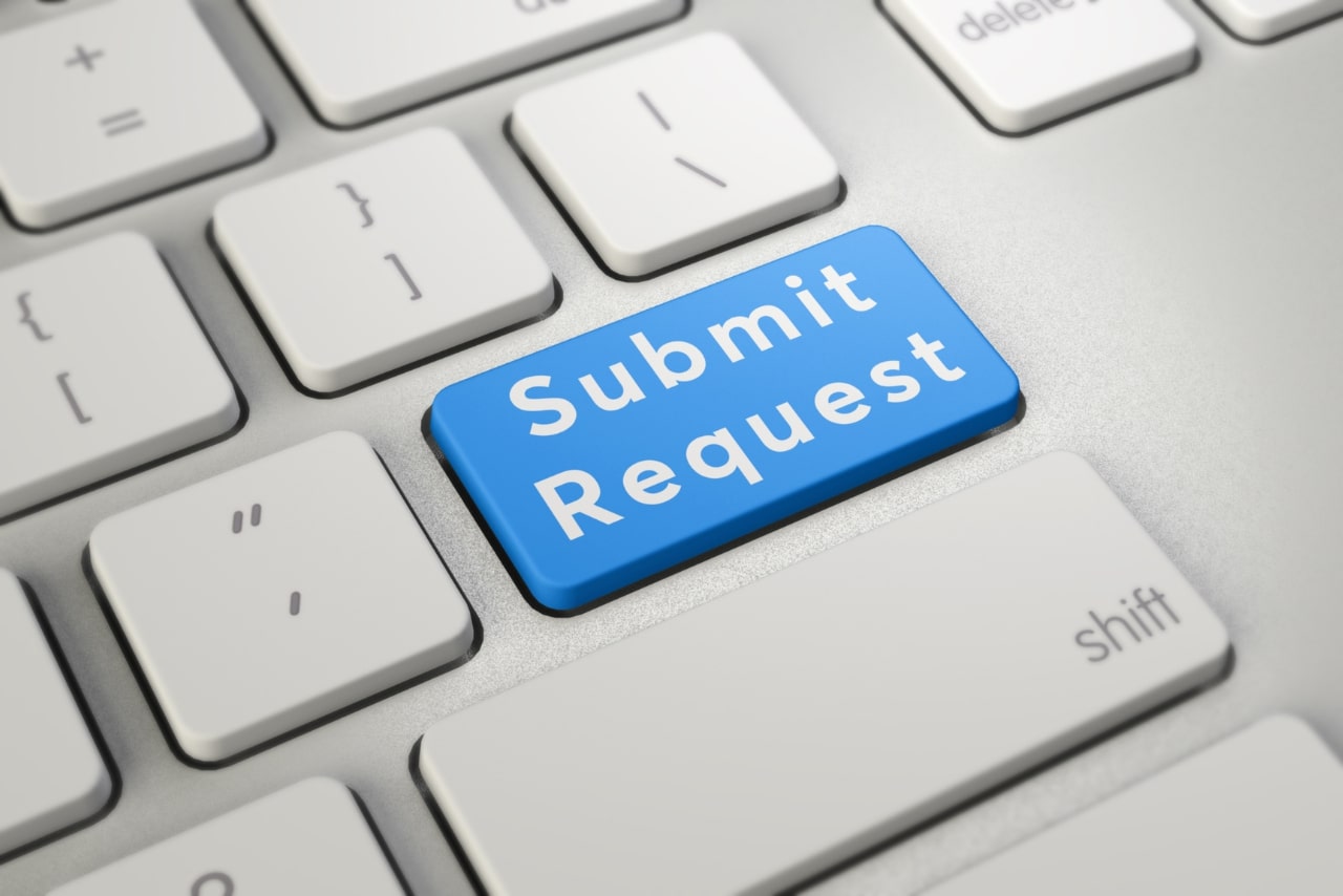 Written word Submit Request on blue keyboard button.