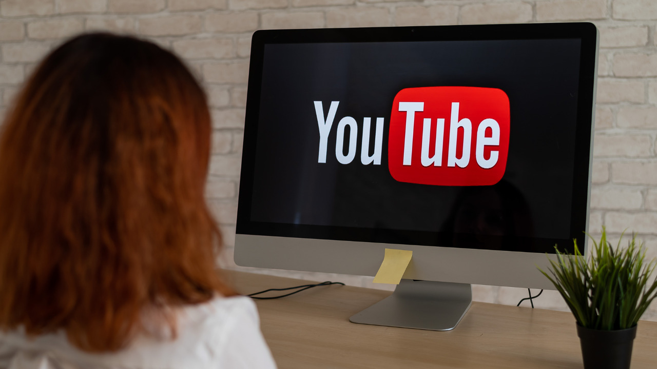 You Tube monitor and a woman