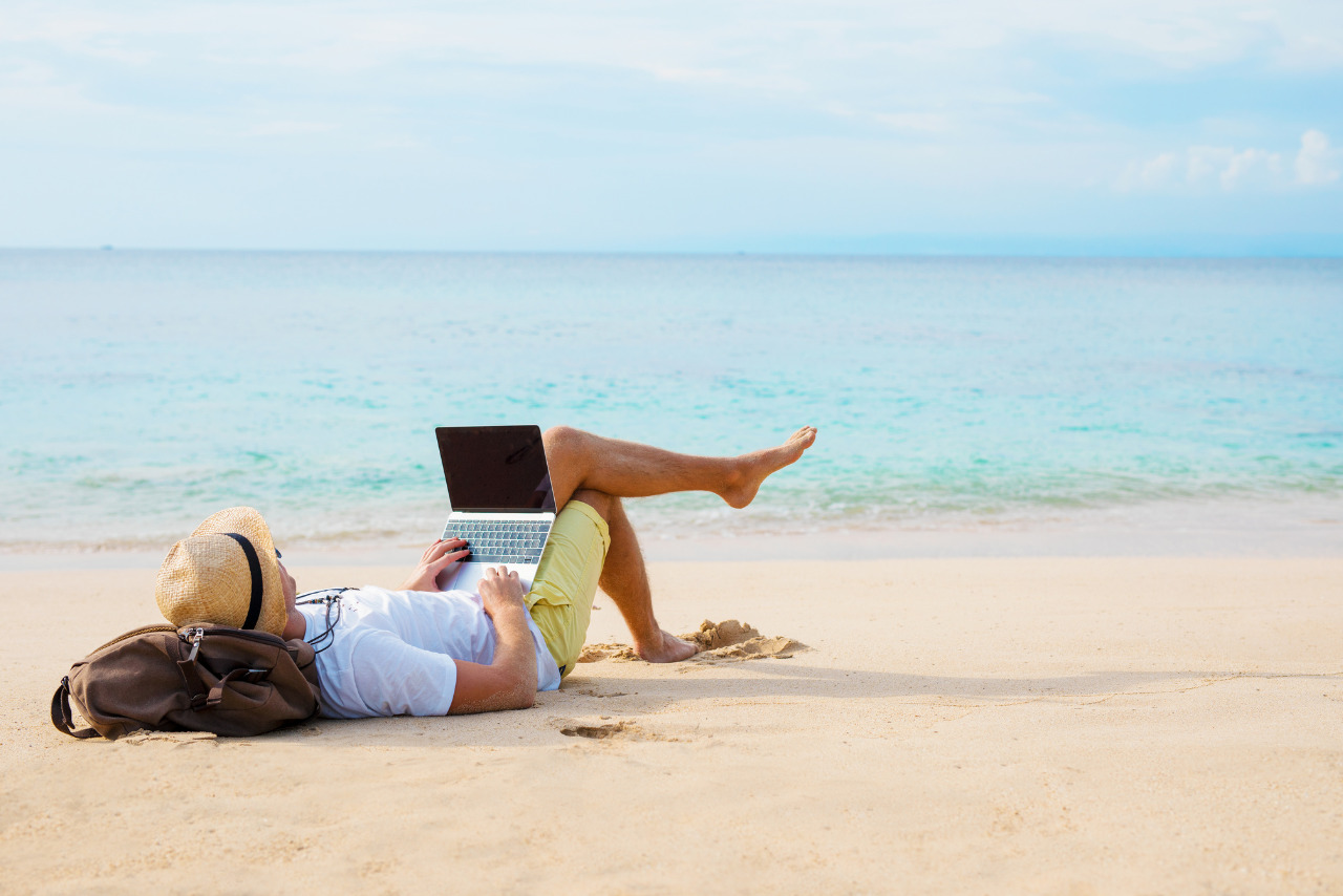 Man accessing website on the beach.