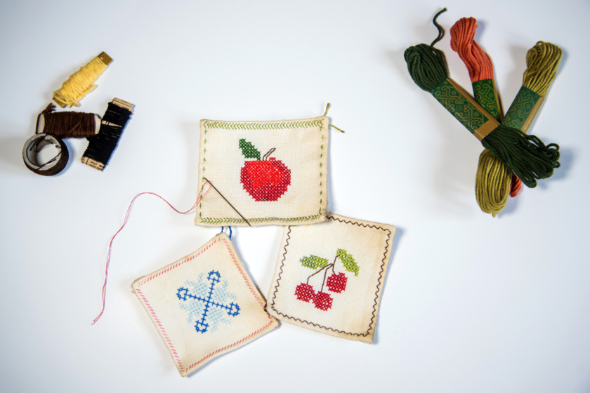 Handmade fabric coasters with various motives.