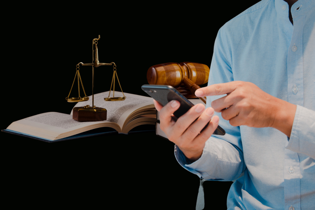 Person using phone with legal objects at the back.