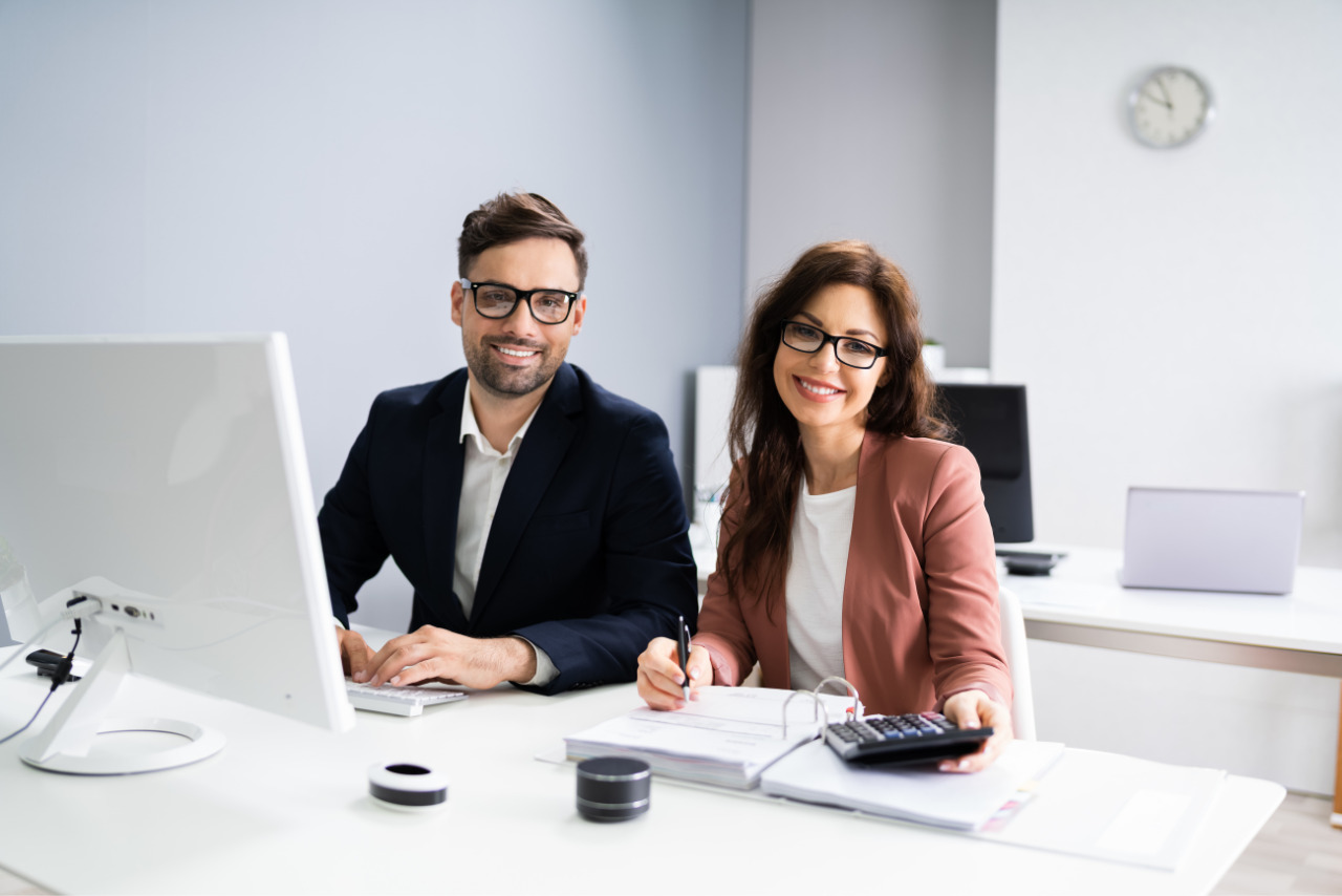 Two Accountant People Doing Tax Audit And Accounting.