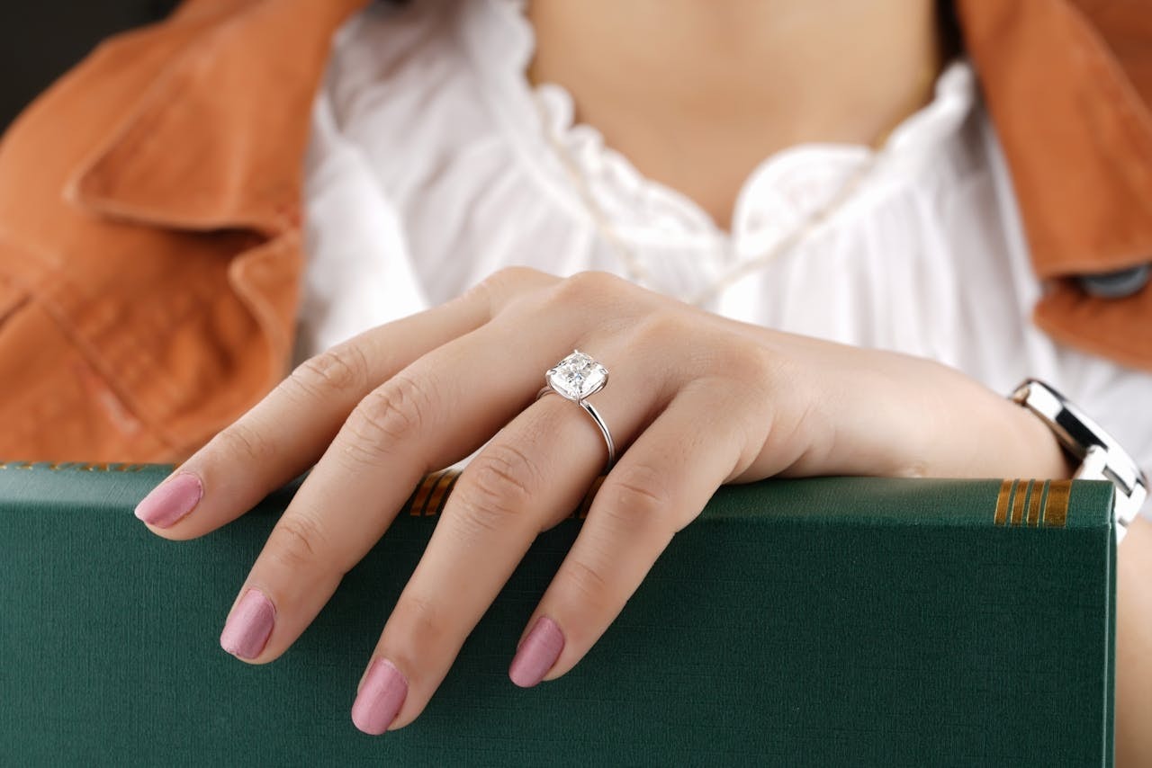 A close-up shot of a ring on a woman's hand