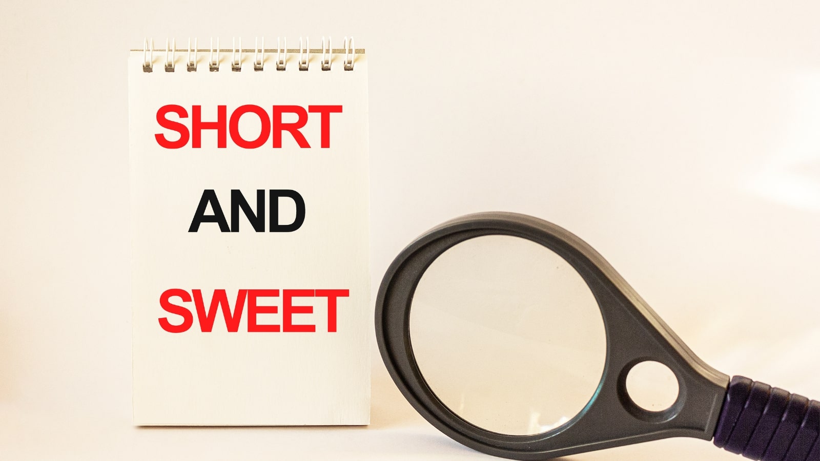 Short and sweet, written on notepad and white background.