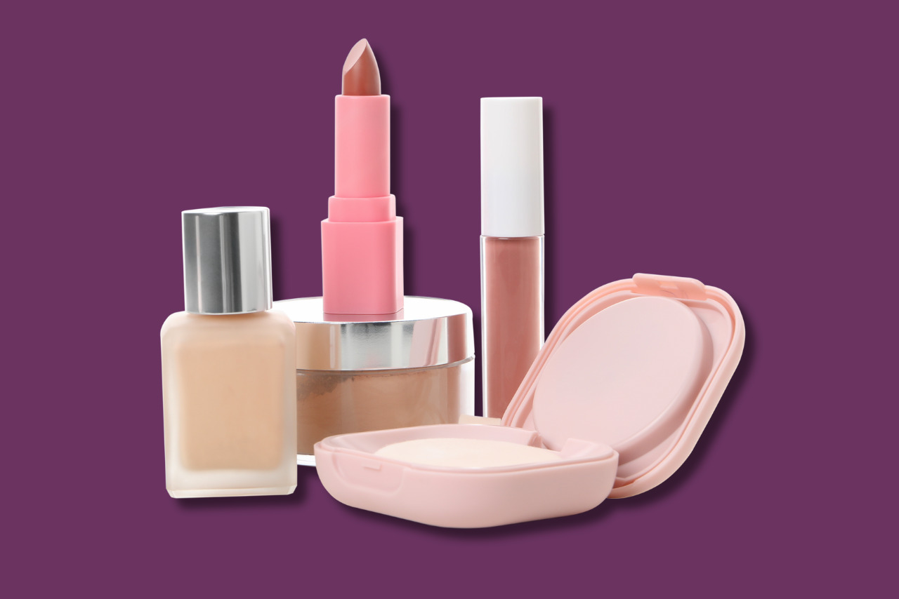 Various unlabeled makeup products, including liquid foundation, lipstick, and pressed powder.