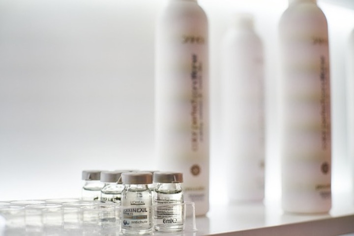 A bottle of serum that enhances healthy skin.