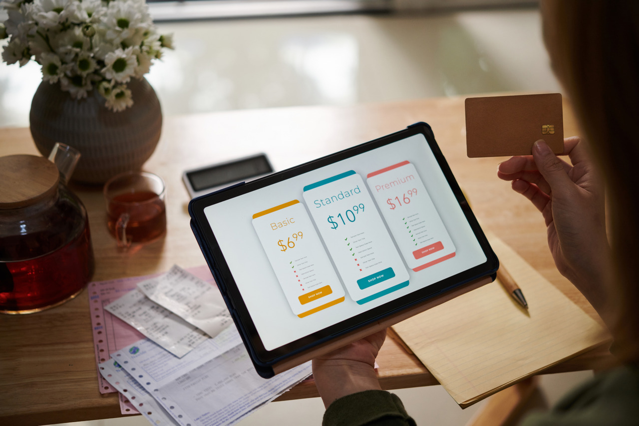Customer paying for IPTV service subscription on tablet.