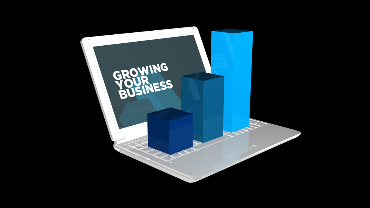 Growing business text with notebook and chart.
