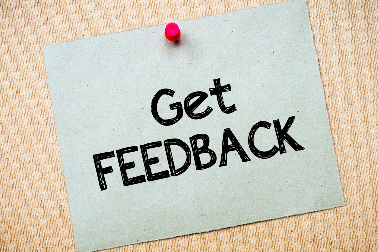 Get Feedback written on recycled paper pinned on corkboard.