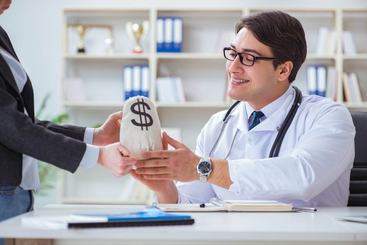 Doctor receives a bag of cash.