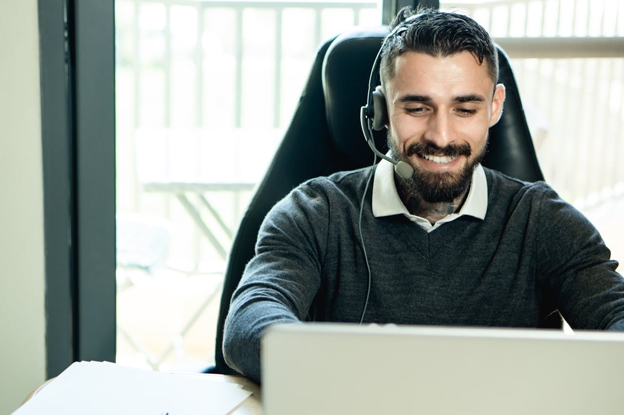 A man wearing headphones while working