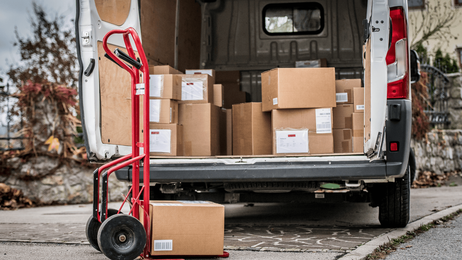Stack of parcels inside delivery van.