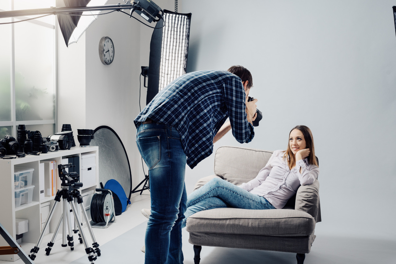 Woman posing during a professional photo shoot at a studio.