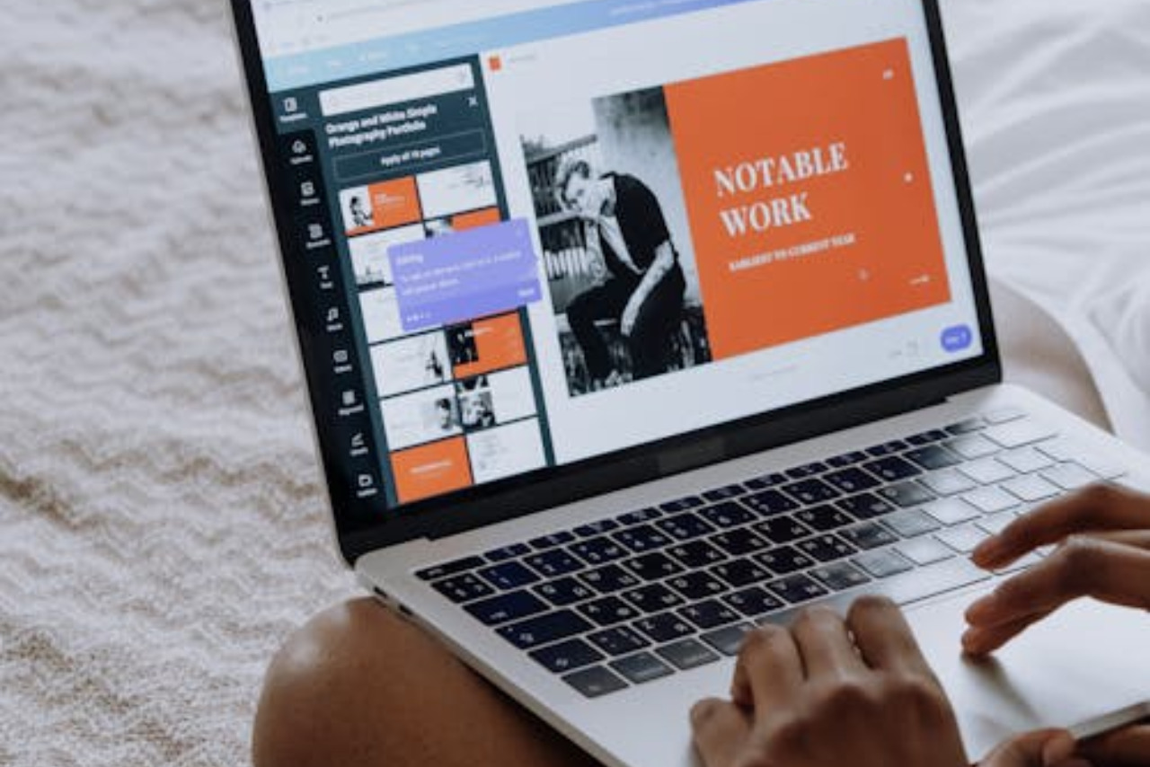 Person building own professional website using laptop.