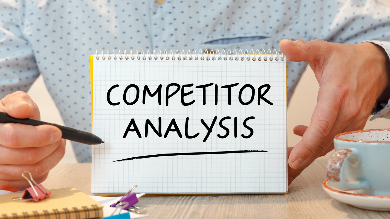 Notebook with text Competitor Analysis near office supplies.
