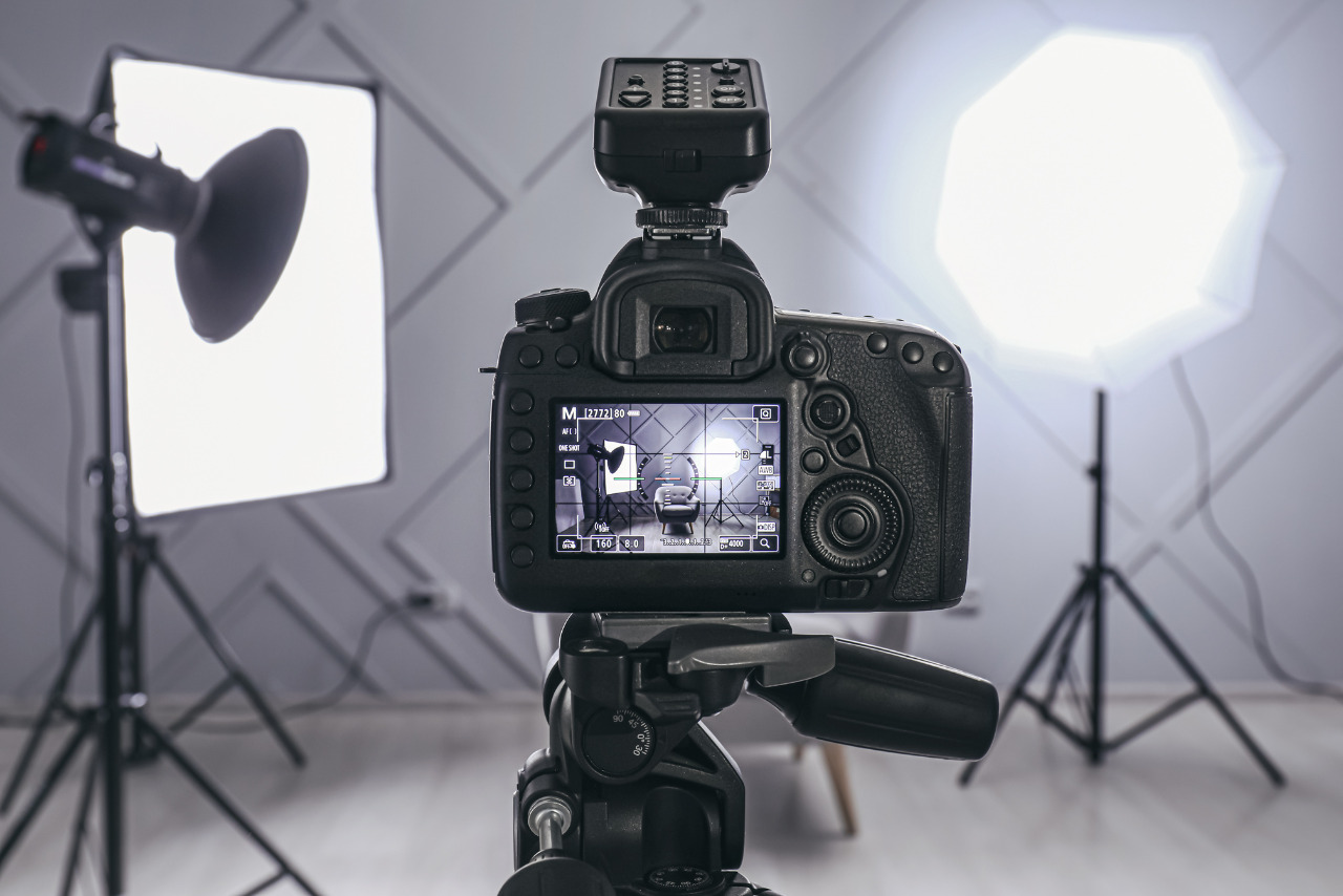 Professional Camera on Tripod in Modern Photo Studio.
