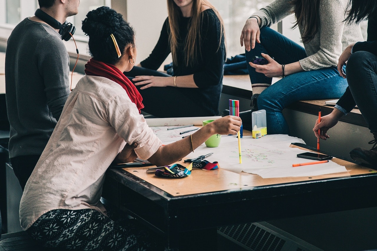 A group of people sharing ideas in a room.