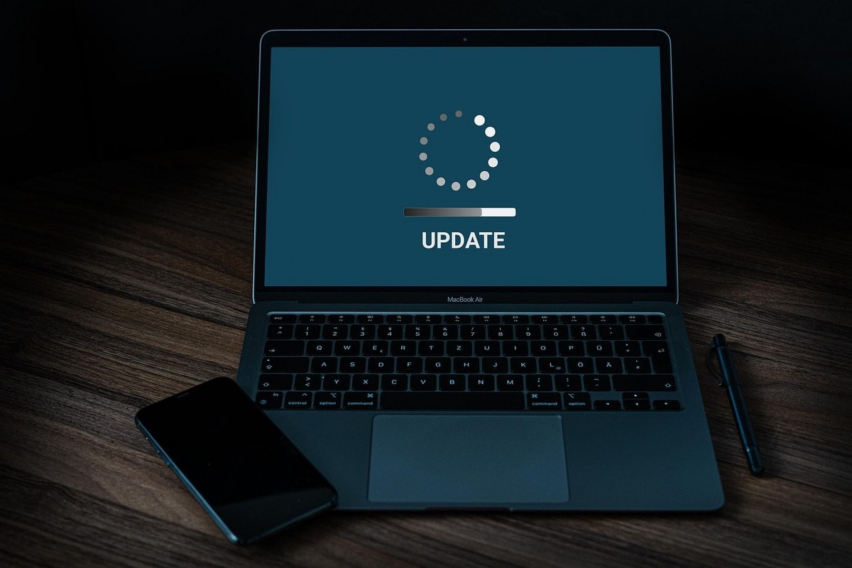 A software update screen on a laptop.