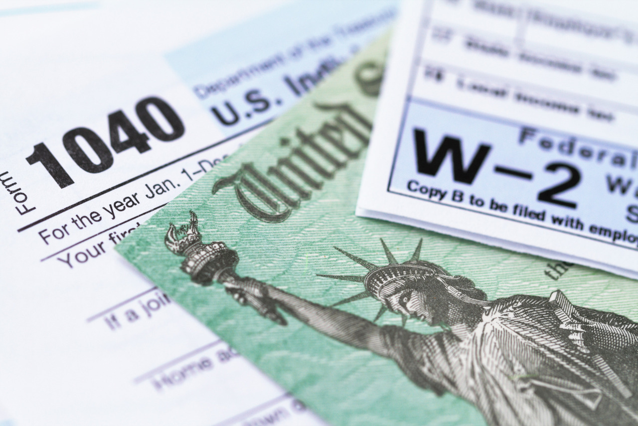 A stack of various tax forms stacked.