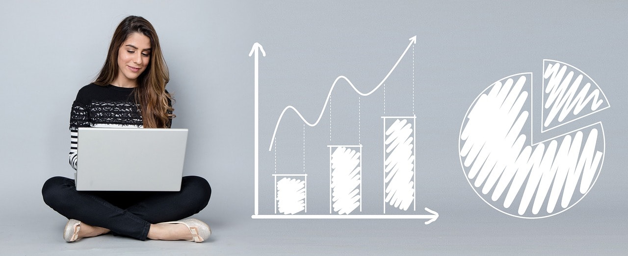 A woman sitted next to business growth indicators.