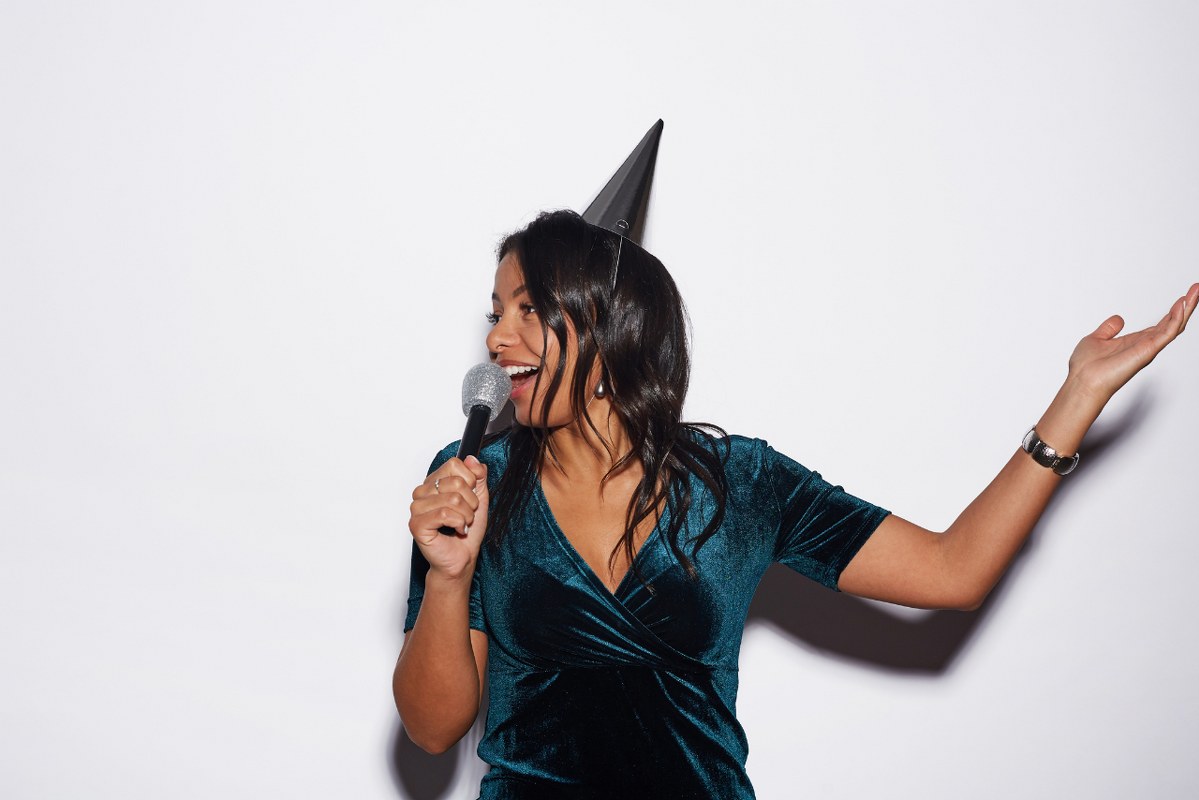 Beautiful Woman Singing at Birthday Party.