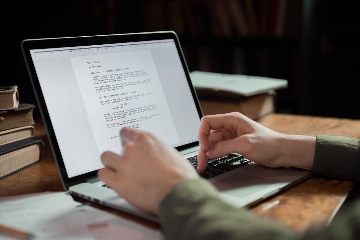 Creative writer working on laptop.