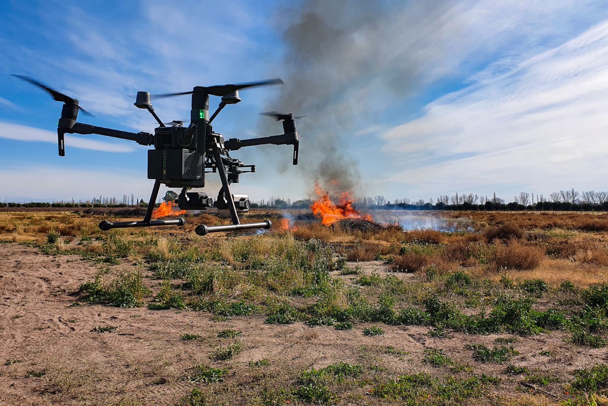 Drone with thermal camera facing at fire.