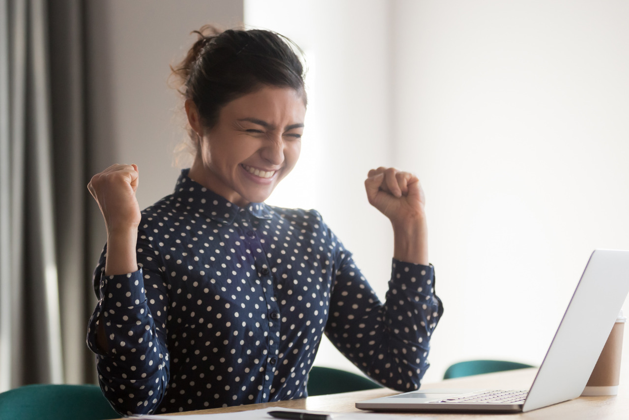 Excited happy female freelancer celebrating success at online work.