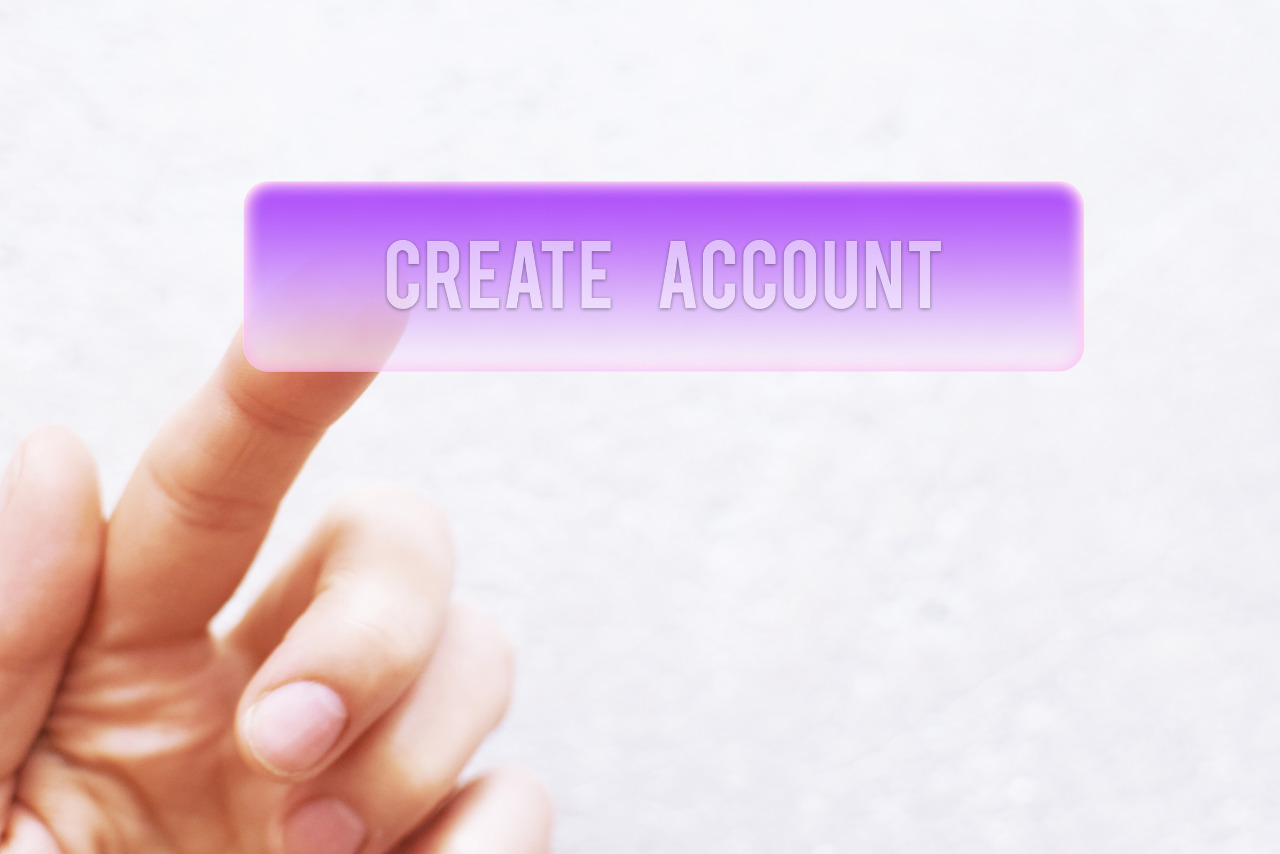 Finger pressing create account button.