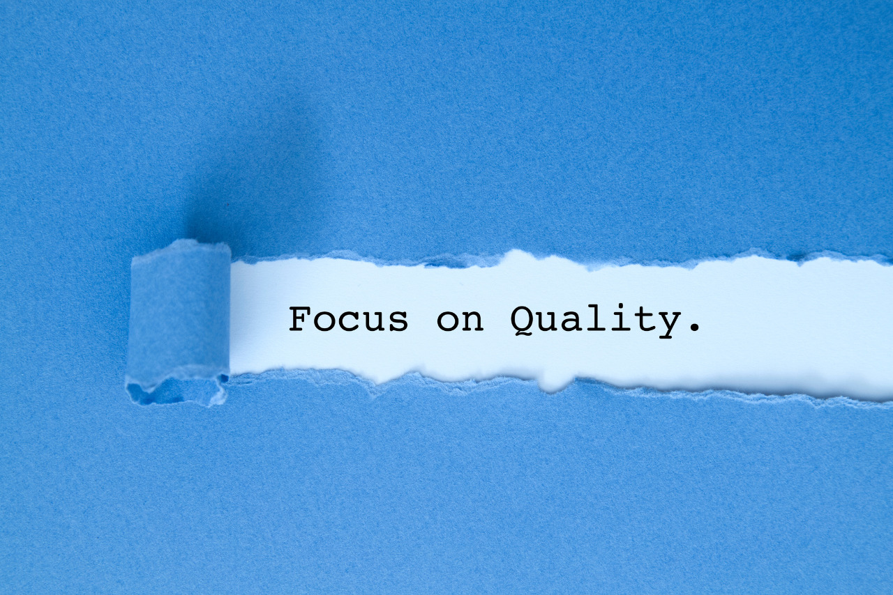 Focus on Quality written under torn paper.