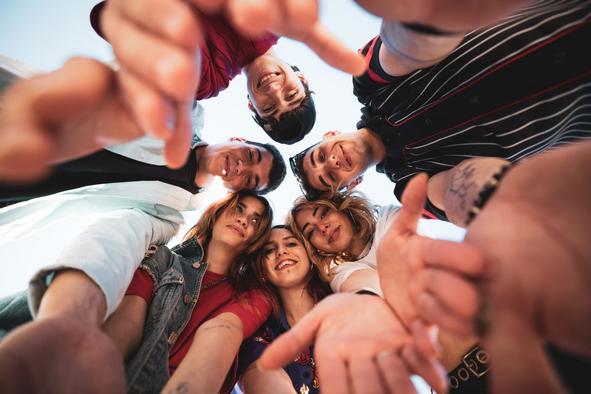 Gen Z teenagers take a happy groufie.