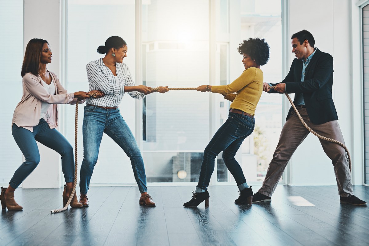 Group of business people pulling tug of war conveying competition.