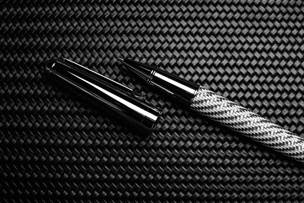 Luxurious pen on carbon surface.