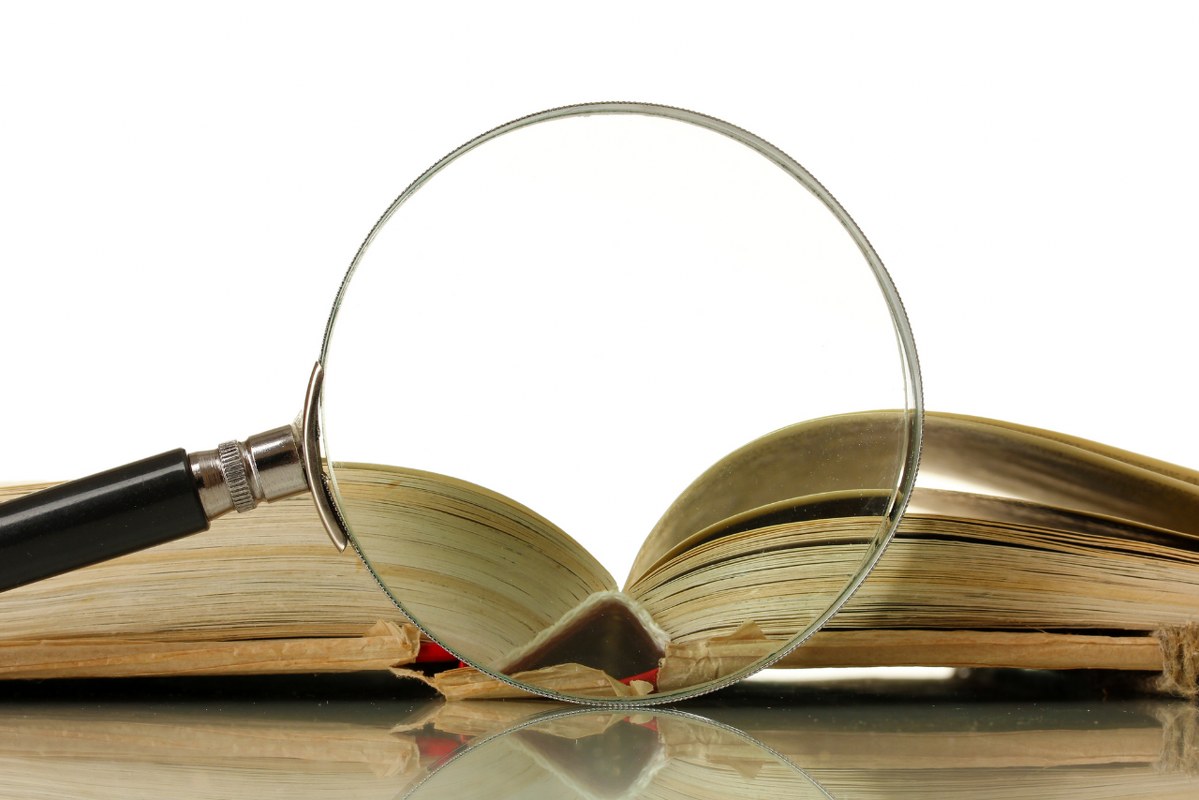 Magnifying Glass with a Open Book.