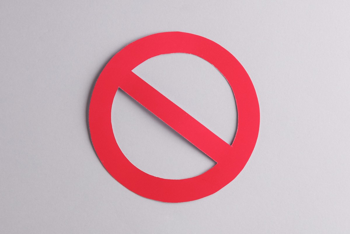 Not Allowed Concept: ban sign isolated on grey background.