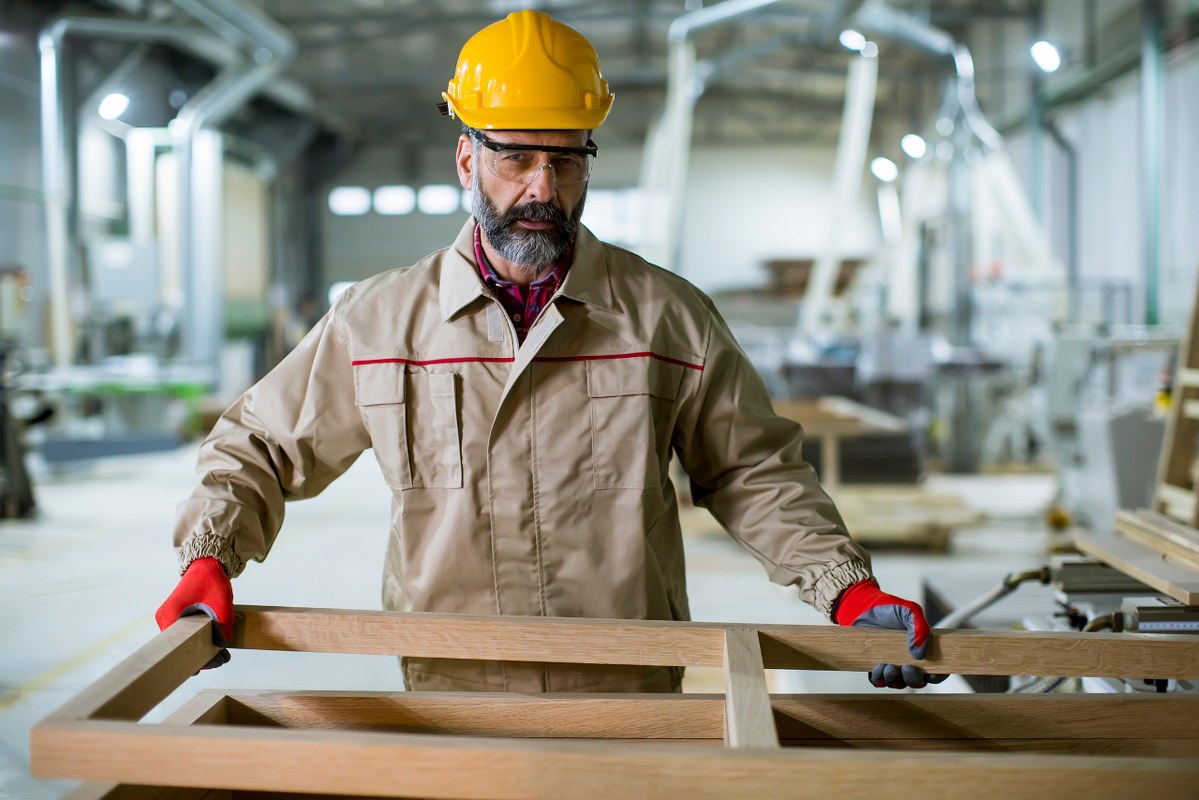 Old Man Working in Furniture Factory.
