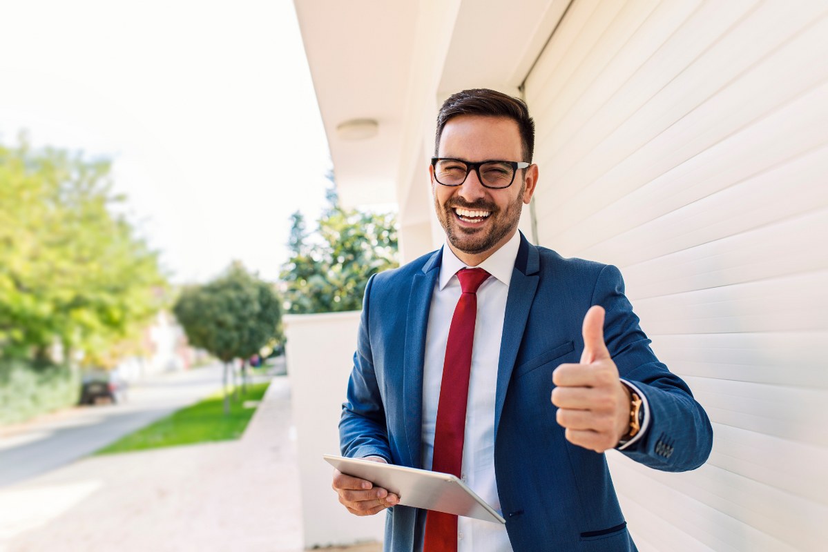 Overjoyed Businessman Giving Thumbs Up because of less competition.